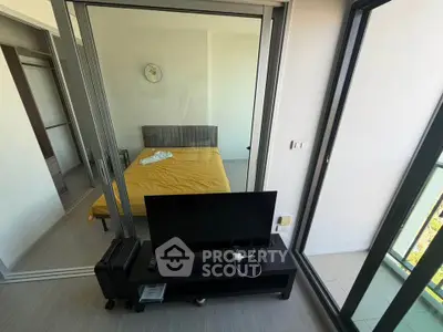 Modern apartment with glass sliding doors and cozy bedroom view