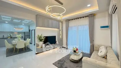 Luxurious modern living room with elegant lighting and open kitchen layout