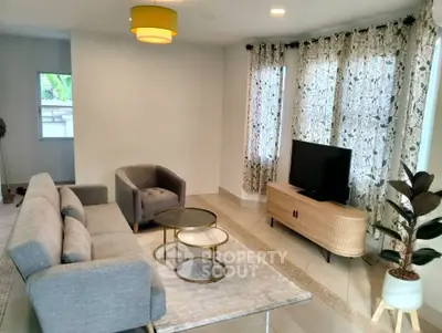 Modern living room with stylish furniture and natural light