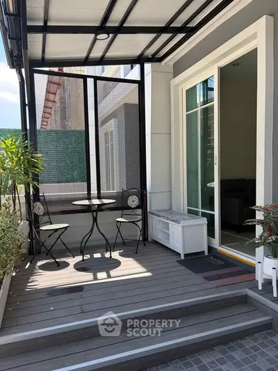 Charming patio with modern outdoor seating and sliding glass door entrance