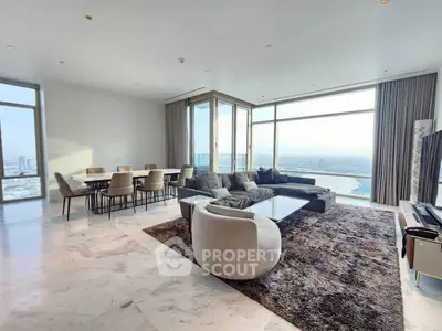 Luxurious high-rise living room with panoramic city views and modern furnishings.