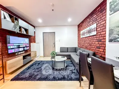 Modern living room with brick accent wall and sleek furniture