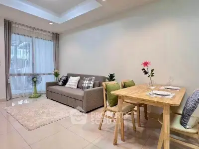 Modern living room with cozy sofa and dining area, perfect for relaxation and entertaining guests.