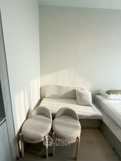 Cozy bedroom corner with modern furniture and natural light