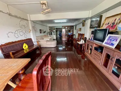 Spacious living room with wooden flooring and classic furniture