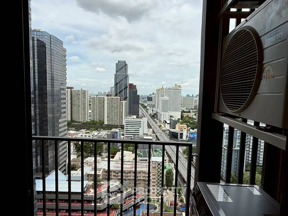 Stunning cityscape view from high-rise balcony with modern architecture