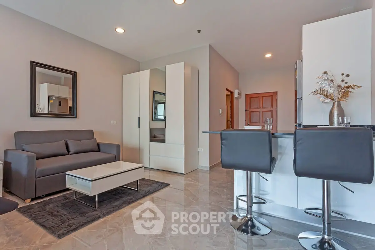 Modern living room with sleek furniture and stylish decor in a contemporary apartment.