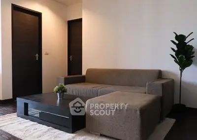 Modern living room with stylish sofa and coffee table, perfect for relaxation and entertainment.