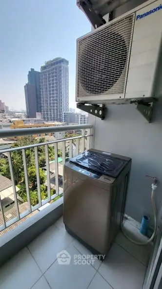 Urban balcony with washing machine and city view, ideal for modern living.