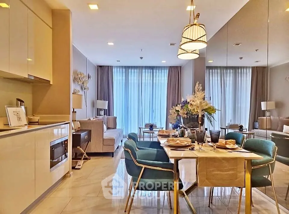 Luxurious open-plan living and dining area with elegant decor and natural light.