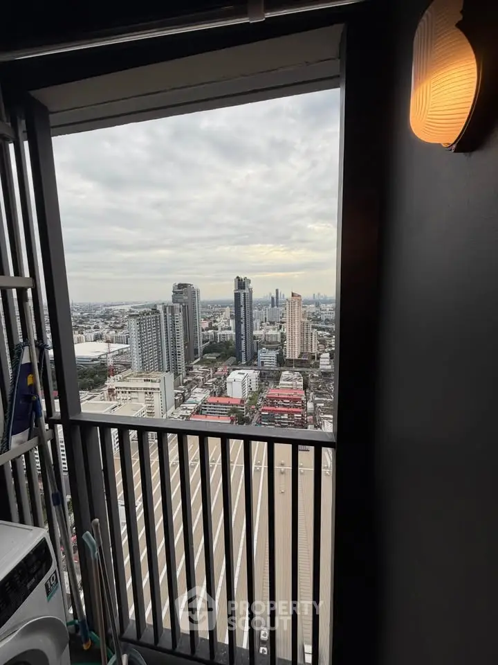 Stunning city view from high-rise balcony with modern lighting.