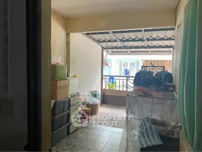 Cozy storage area with balcony access in urban apartment