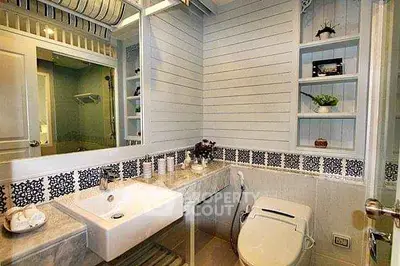 Charming bathroom with modern fixtures and decorative shelving