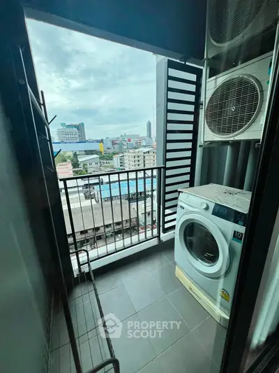 Modern balcony with washing machine and city view, perfect for urban living convenience.