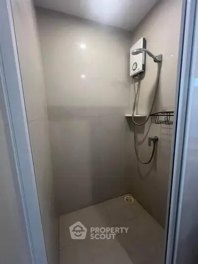 Modern shower area with sleek design and wall-mounted showerhead