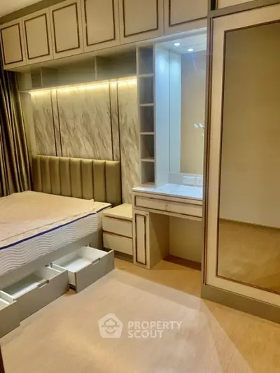 Luxurious bedroom with elegant built-in storage and stylish vanity area