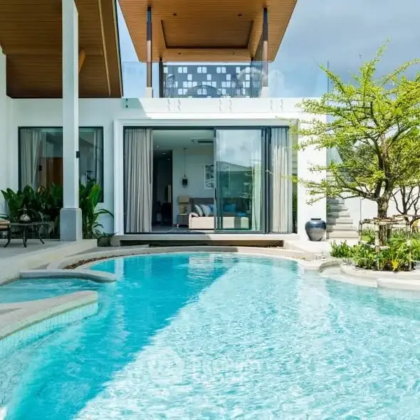 Luxurious modern villa with private pool and lush garden, perfect for relaxation and entertainment.