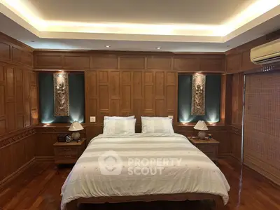Luxurious wooden bedroom with elegant lighting and cozy ambiance
