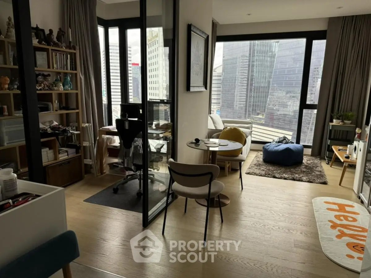 Modern apartment with city view, featuring open living space and stylish decor.
