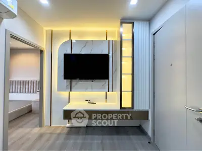 Modern living room with sleek TV unit and ambient lighting