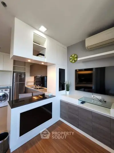 Modern kitchen with sleek design, featuring open layout and stylish appliances.
