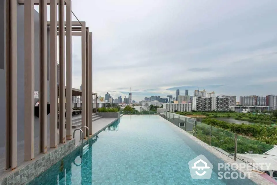 Luxurious rooftop infinity pool with stunning city skyline view