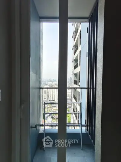 Modern high-rise balcony with city view, perfect for urban living enthusiasts.