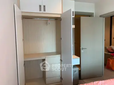 Spacious bedroom with built-in wardrobe and modern design