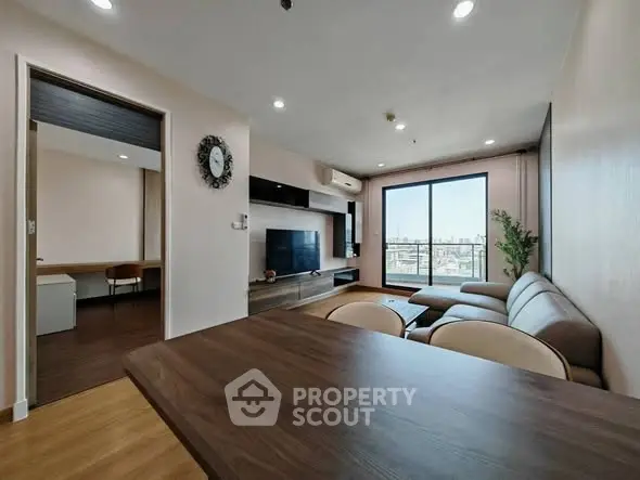 Spacious modern living room with city view and stylish decor