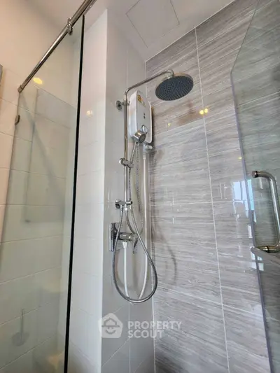 Modern bathroom with sleek shower fixtures and glass enclosure