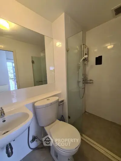 Modern bathroom with glass shower and sleek fixtures
