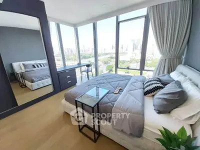Luxurious bedroom with panoramic city views and modern decor