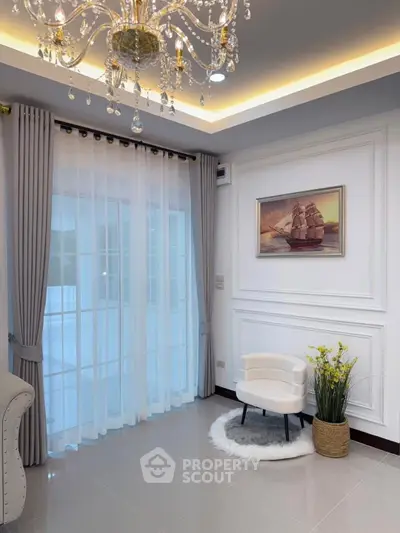 Elegant living room with chandelier and modern decor