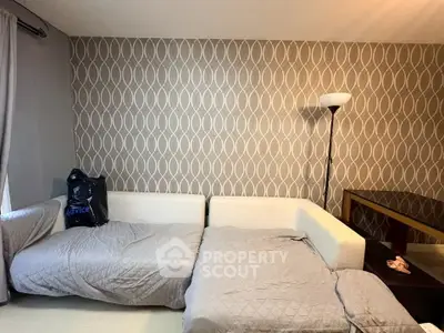 Cozy bedroom with stylish wallpaper and modern furniture