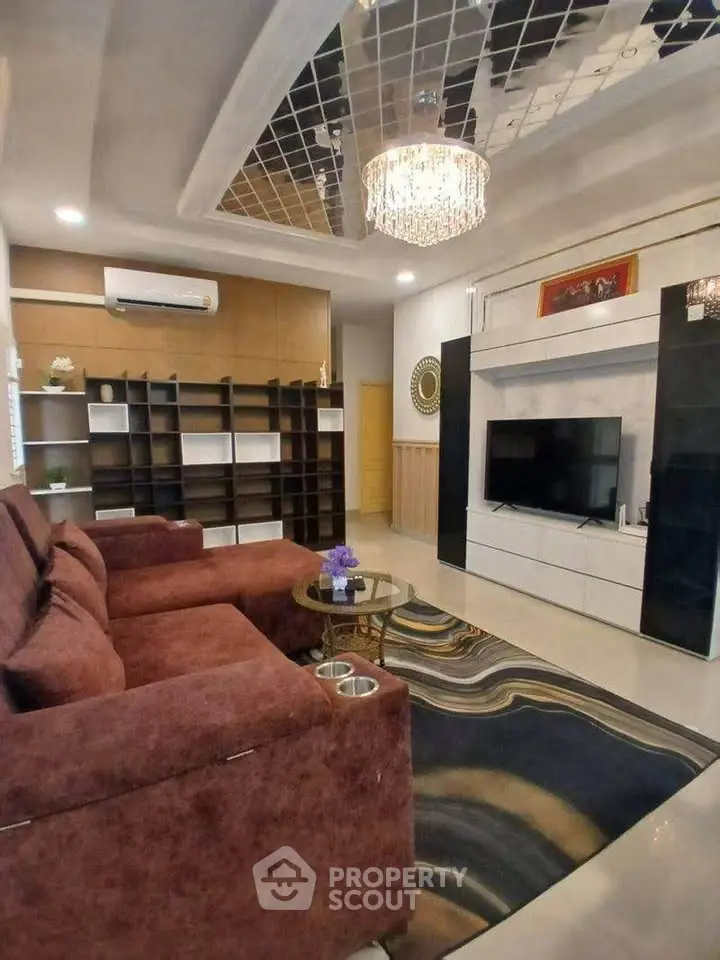 Luxurious living room with modern decor and elegant chandelier