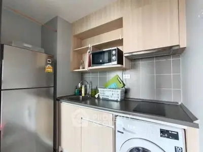 Modern kitchen with stainless steel appliances and sleek cabinetry