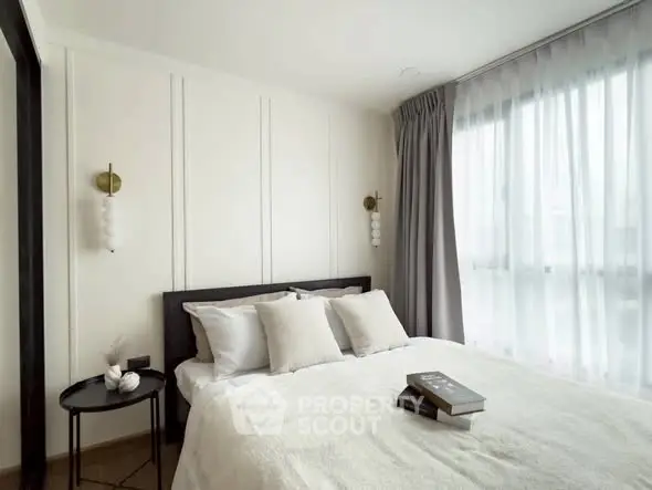 Elegant bedroom with modern decor and natural light