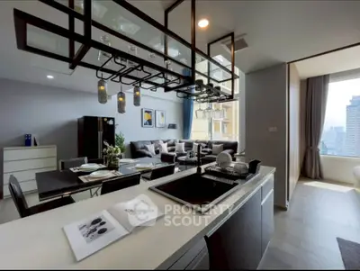 Modern open-layout kitchen and living room with city view, stylish decor, and ample natural light.
