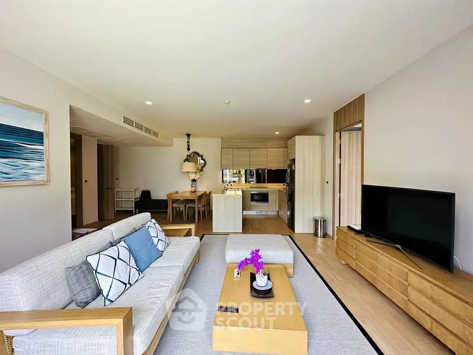 Spacious modern living room with open kitchen and stylish decor