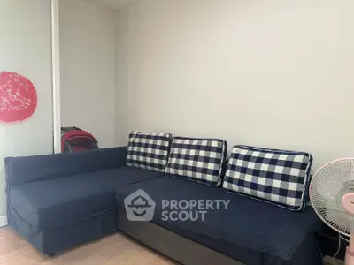 Cozy living room with stylish checkered sofa and modern decor