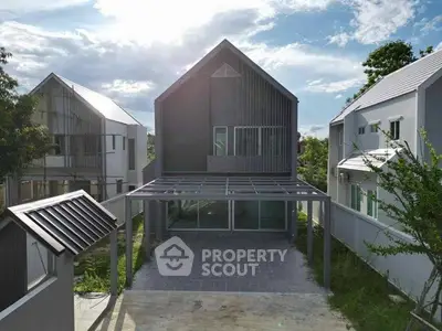 Modern minimalist house exterior with sleek design and spacious driveway, perfect for contemporary living.