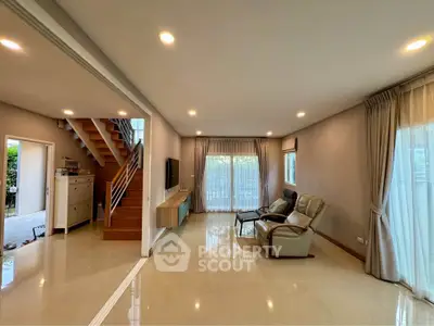 Spacious modern living room with elegant decor and natural light