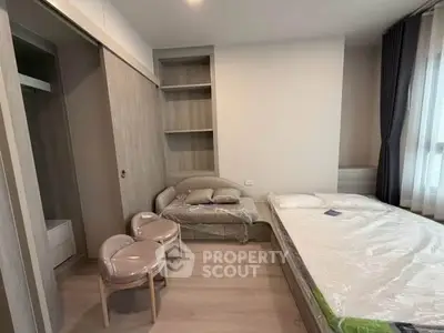 Modern bedroom with stylish furniture and ample storage space