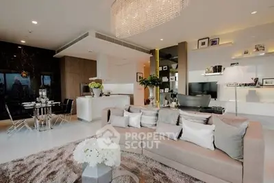 Luxurious open-plan living room with modern kitchen and elegant decor