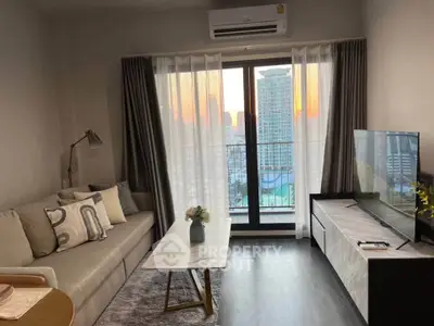 Modern living room with city view, stylish furniture, and natural light through large windows.