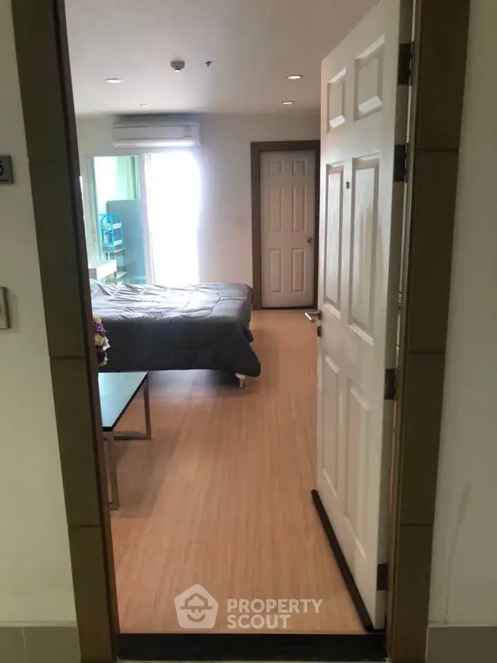 Inviting bedroom with natural light and modern decor, perfect for relaxation and comfort.