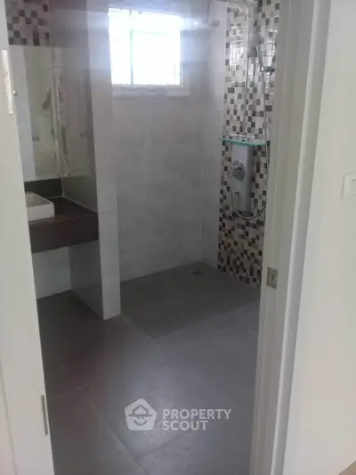 Modern bathroom with sleek tiles and stylish shower area