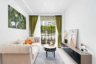 Elegant living room with modern decor and large window view