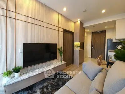 Modern living room with stylish decor and wall-mounted TV
