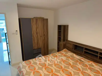Cozy bedroom with modern wooden furniture and stylish bedding